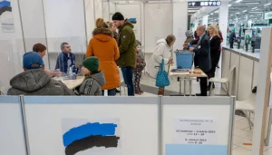 People cast their vote in a polling station at a shopping centre in Tallinn, Estonia on March 5, 2023 during parliamentary elections. —AFP