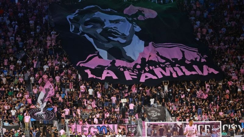 GETTY IMAGES Image caption, Fans unfurled a banner to welcome Messi to the Inter Miami "family"