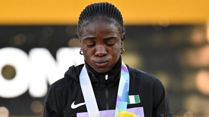 EUGENE, UNITED STATES – JULY 24: Gold medalist and world record holder Tobi Amusan of Team Nigeria poses during the medal ceremony for Women’s 100m Hurdles final at the 18th edition of the World Athletics Championships at Hayward Field in Eugene, Oregon, United States on July 24, 2022. Mustafa Yalcin / Anadolu Agency (Photo by MUSTAFA YALCIN / ANADOLU AGENCY / Anadolu Agency via AFP)