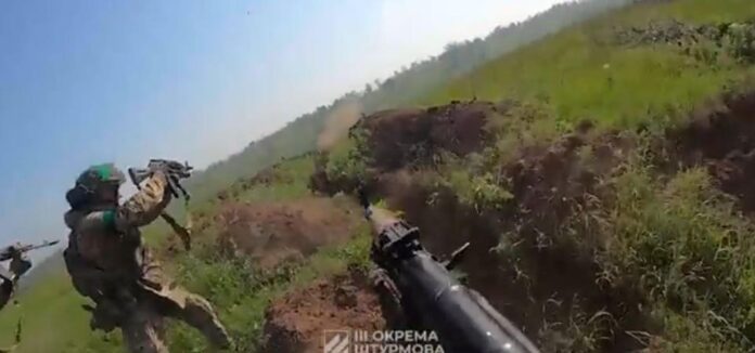 Ukrainian troops assault a Russian trench.3RD ASSAULT BRIGADE CAPTURE