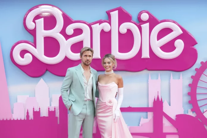 FILE - Ryan Gosling, left, and Margot Robbie pose for photographers upon arrival at the premiere of the film ‘Barbie’ on July 12, 2023, in London. “Barbie” is set to open across the Middle East on Thursday, Aug. 10, but moves by Kuwait and Lebanon to ban the film — apparently over it’s alleged LGBTQ themes — has raised questions over how widely it will be released. (Scott Garfitt/Invision/AP, File)