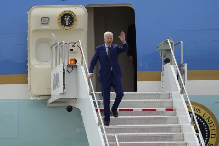 President Joe Biden exits Air Force One after landing at Roland R. Wright Air National Guard Base, Wednesday, Aug. 9, 2023, in Salt Lake City. (Francisco Kjolseth/The Salt Lake Tribune via AP)