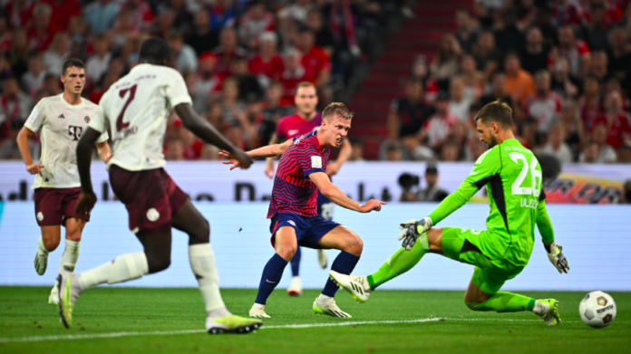 RB Leipzig midfielder Dani Olmo scores second goal against Bayern Munich.