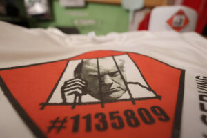 T-shirts and hats with an image depicting the mugshot of former President Donald Trump are pictured at the Y-Que printing store in Los Angeles, California, on August 25, 2023. (REUTERS)