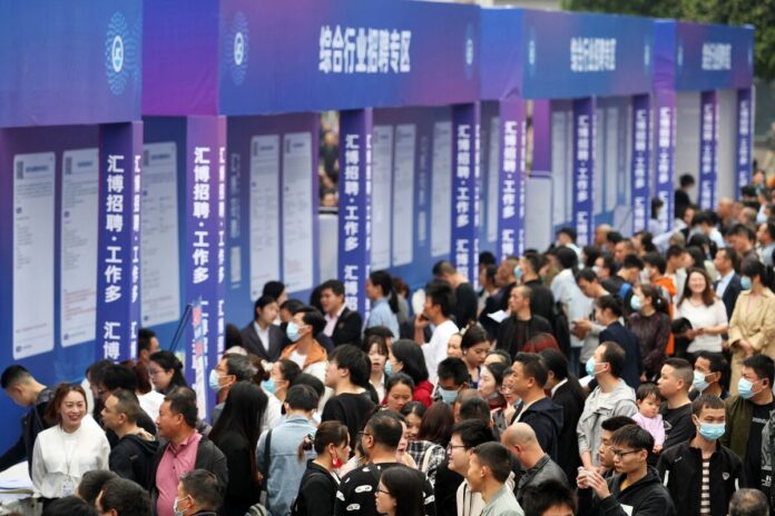 Jobseekers at an employment fair in Chongqing in April 2023. Photographer: AFP/Getty Images