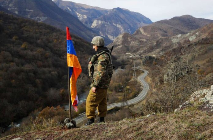 An ethnic Armenian soldier stands guard in the separatist region of Nagorno-Karabakh in 2020.