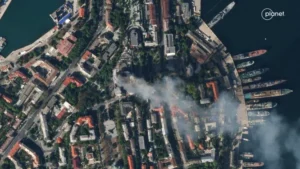 A satellite image shows smoke billowing from Russian Black Sea navy headquarters after a missile strike, as Russia’s invasion of Ukraine continues, in Sevastopol, Crimea, on Sept. 22, 2023.     Planet Labs PBC | Handout | via Reuters