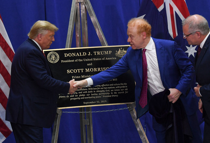TRUMP US President Donald Trump (L) shakes hands with Global Chairman of Pratt/Visy Industries Anthony Pratt (2R) as Australian Prime Minister Scott Morrison looks on during a visit to Pratt Industries plant opening in Wapakoneta, Ohio on September 22, 2019. (AFP/File)
