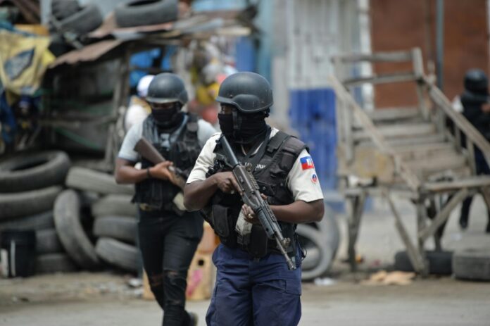 Police officers patrol a neighborhood amid gang-related violence in downtown Port-au-Prince in April 2023 - Copyright AFP/File RICHARD PIERRIN