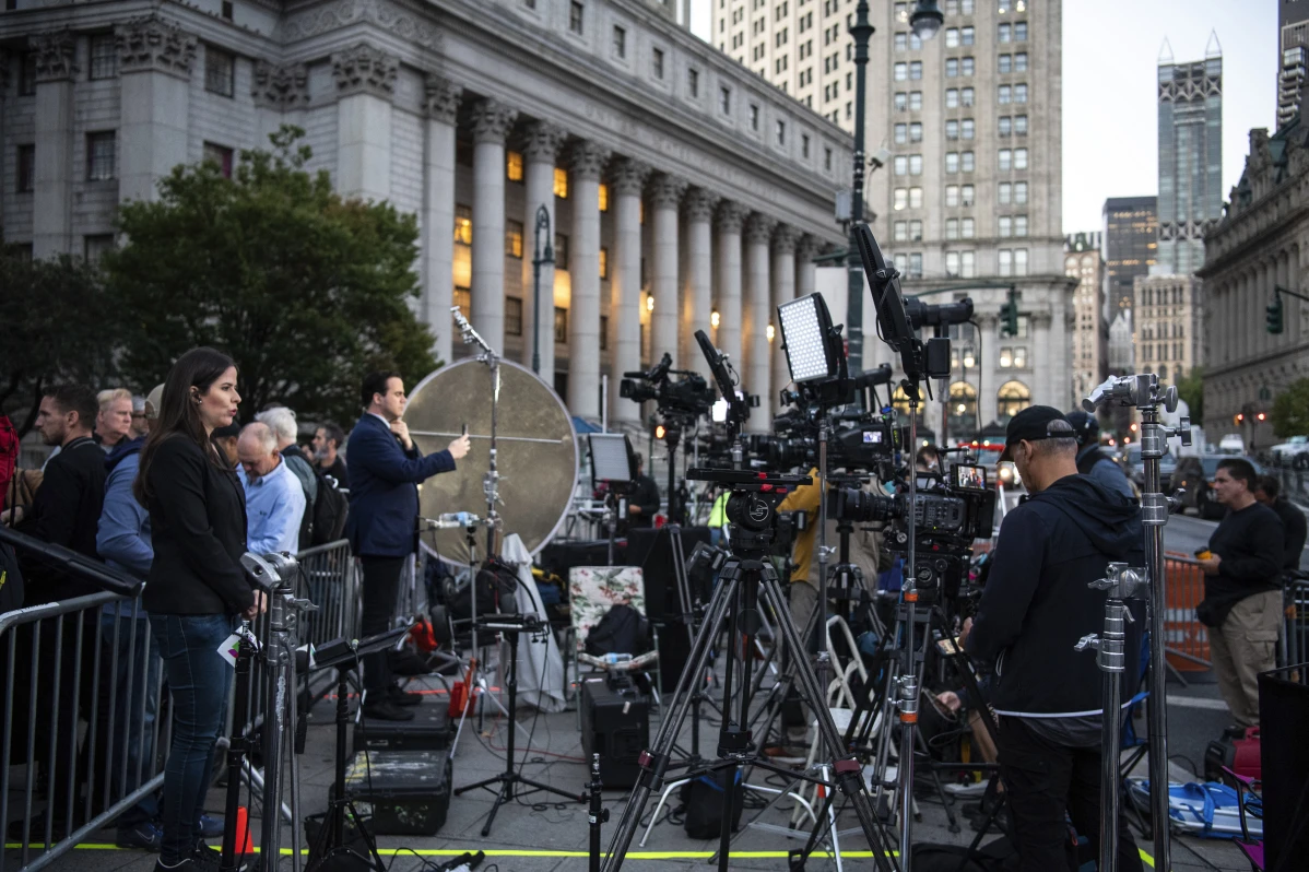 Members of the press set up outside of the court building ahead of former President Donald Trump’s civil trial on Monday, Oct. 2, 2023 in New York. (AP Photo/Brittainy Newman)