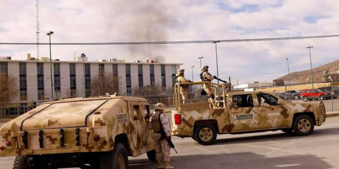 Mexican Army arrive to the Cereso number 3 state prison after unknown assailants entered the prison and freed several inmates, resulting in injuries and deaths, according to local media, in Ciudad Juarez, Mexico January 1, 2023. JOSE LUIS GONZALEZ / REUTERS
