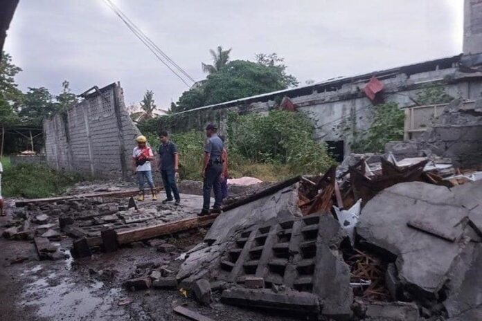Investigators are examining the location where Danny and Jane Ginung were caught under debris from a concrete fence damaged by the earthquake on Nov. 17, 2023. Philstar.com / John Unson