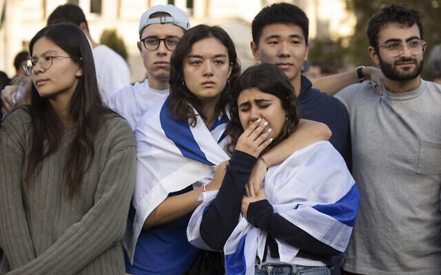 Pro-Israel demonstrators react while singing a song during a protest at Columbia University, October 12, 2023, in New York. (AP/Yuki Iwamura)