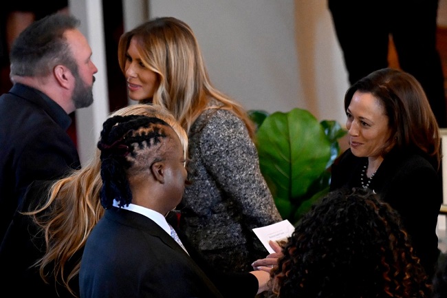 Former US First Lady Melania Trump greets US country singer Garth Brooks, as US Vice President Kamala Harris greets US country singer Trisha Yearwood, during a tribute service for former US First Lady Rosalynn Carter, at Glenn Memorial Church in Atlanta, Georgia, on November 28, 2023.  (Photo by ANDREW CABALLERO-REYNOLDS / AFP)