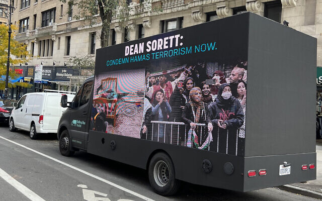 A truck emblazoned with a poster calling on the dean of Columbia College at Columbia University to comdemn Hamas terrorism is parked on Broadway. (Nathan J. Saldinger)