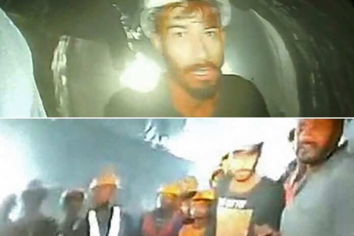 This picture released by Department of Information and Public Relation (DIPR) Uttarakhand and taken with endoscopic camera on November 21, 2023 shows a group of workers trapped inside the under-construction tunnel, days after it collapsed in the Uttarkashi district of India’s Uttarakhand state. (Photo by Department of Information and Public Relation (DIPR) Uttarakhand / AFP)