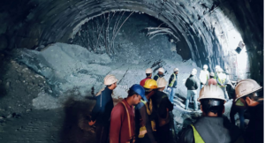  In this photograph taken on November 12, 2023, rescue workers gather at the site after a tunnel collapsed in the Uttarkashi district of India’s Uttarakhand state. Rescue workers in northern India said on November 13 they had made contact with 40 workers trapped for over 24 hours after the road tunnel they were building collapsed. (Photo by AFP