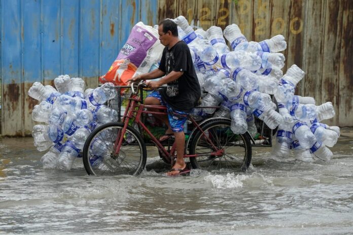Climate change increases the risk and intensity of flooding from extreme rainfall in the Philippines.(AP pic)