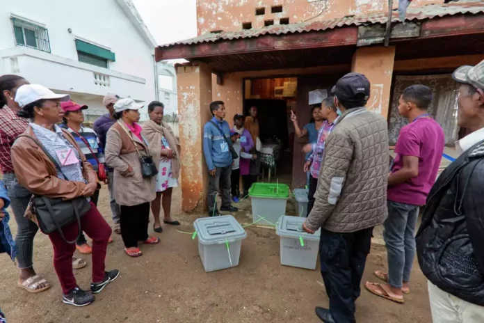 People gather at a polling station in the presidential election in Antananarivo, Madagascar Thursday, Nov. 16, 2023. Madagascar's President Andry Rajoelina is pushing ahead with a presidential election Thursday, that could give him a third term, even as opposition protests roil the country and the majority of candidates have announced a boycott.Alexander Joe/AP Show Less