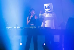 Marshmello and Nancy Ajram performing at the Gamers8 event in Riyadh. Photo by NASSER AL-HARBI/AFP via Getty Images
