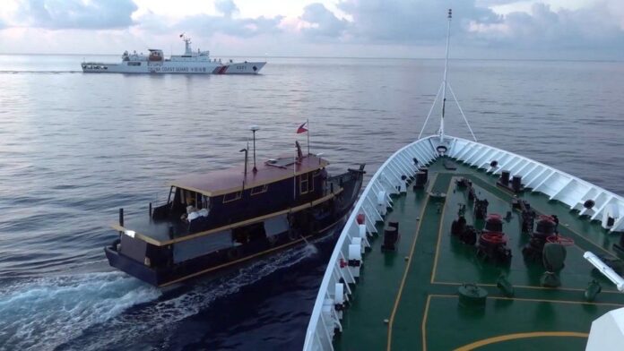 Photo supplied by the Philippine Coast Guard showing Chinese militia boats operating in Whitsun Reef. REUTERS