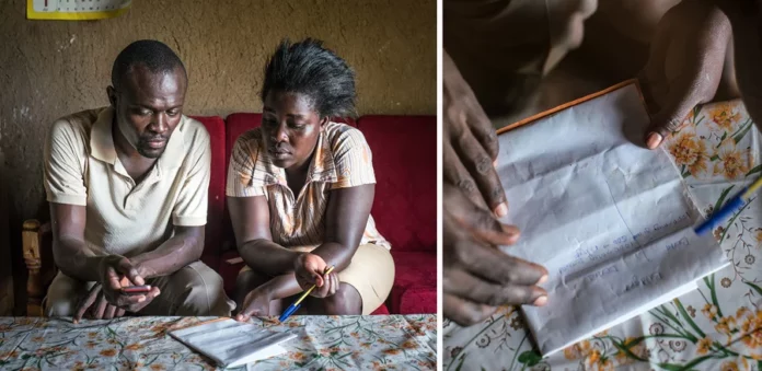 Husband and wife Denis and Bentha Otieno at their home in 2017, calculating their monthly budget shortly after they began receiving a monthly grant from the charity GiveDirectly. Researchers are studying whether the grant program — which provides $50 every month over 12 years — can lift people out of poverty. Nichole Sobecki for NPR