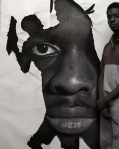 Ken Nwadiogbu poses next to one of his hyperrealistic artworksCredit: Ken Nwadiogbu