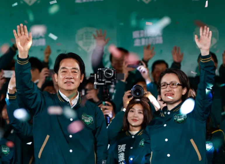 William Lai Ching-te (L) and vice presidential candidate Hsiao Bi-khim (R) celebrate amid a shower of confetti during a rally after winning the presidential elections in Taipei, Taiwan, January 13, 2024 [EPA]