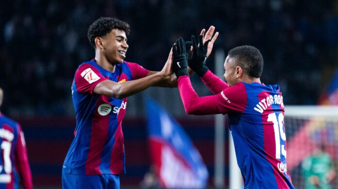 Barcelona’s Brazilian forward #19 Vitor Roque celebrates scoring the opening goal, with Barcelona’s Spanish forward #27 Lamine Yamal during the Spanish league football match between FC Barcelona and CA Osasuna at the Estadi Olimpic Lluis Companys in Barcelona on January 31, 2024. (Photo by LLUIS GENE / AFP)