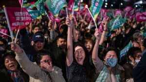Crowds cheer at a Democratic Progressive Party rally in Taipei after the party's historic victory on Jan. 13, 2024. Louise Delmotte/AP