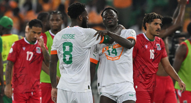 Ivory Coast’s midfielder #8 Franck Kessie consoles Ivory Coast’s forward #14 Oumar Diakite after Equatorial Guinea won the Africa Cup of Nations (CAN) 2023 group A football match between Equatorial Guinea and Ivory Coast at the Alassane Ouattara Olympic Stadium in Ebimpe, Abidjan on January 22, 2024. (Photo by Issouf SANOGO / AFP)