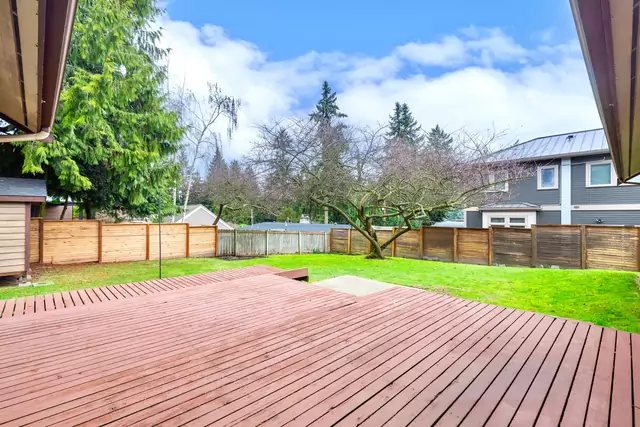  In the back yard, you'll find a large deck.