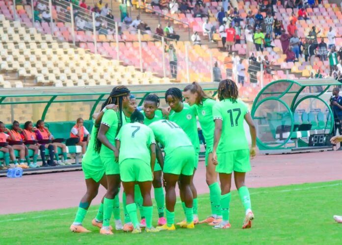 Super Falcons celebrate hard-fought 1-0 victory against the Indomitable Lionesses of Cameroon at the Moshood Abiola Stadium, Abuja on Monday.