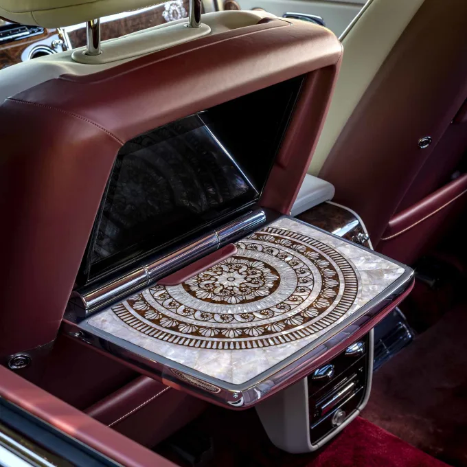 Mother-of-pearl inlay on a folding tray table inside a customized Rolls-Royce Cullinan SUV.  Courtesy Rolls-Royce