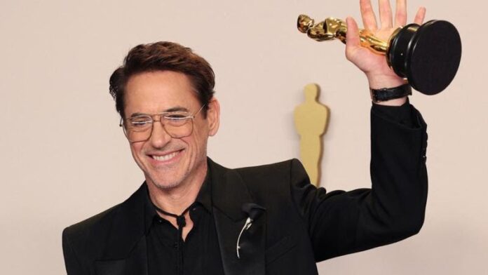 Robert Downey Jr has won his first Oscar, for best supporting actor for Oppenheimer