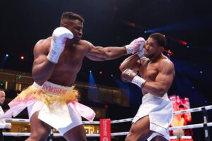 Francis Ngannou punches Anthony Joshua during the heavyweight fight on the Knockout Chaos boxing card at the Kingdom Arena on March 8, 2024 in Riyadh, Saudi Arabia.  Richard Pelham, Getty Images