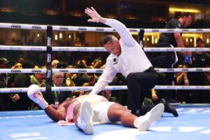Francis Ngannou is knocked down for the third time as referee Ricky Gonzalez stops the fight against Anthony Joshua on the Knockout Chaos boxing card at the Kingdom Arena on March 8, 2024 in Riyadh, Saudi Arabia.  Richard Pelham, Getty Images