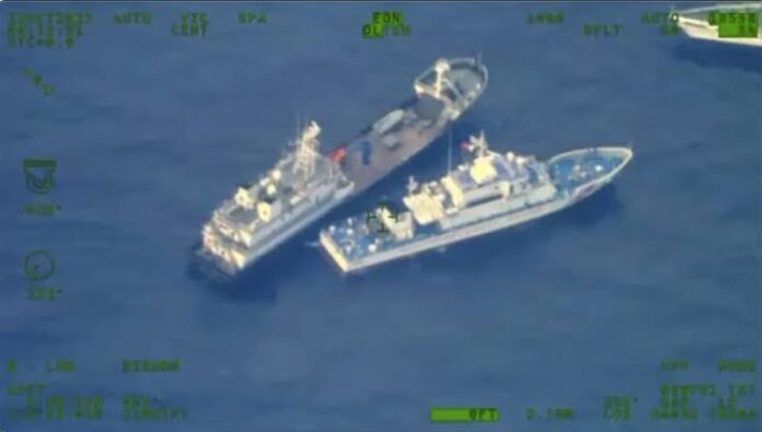 The image released by the Armed Forces of the Philippines show a Chinese vessel and Philippine coast guard vessel at the disputed South China Sea on Oct. 22.Source: Armed Forces of the Philippines via AP