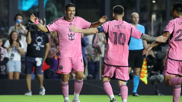 Luis Suarez and Lionel Messi celebrate after scoring a goal for Miami against Nashville in the Concacaf Champions Cup.