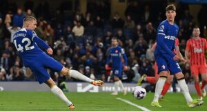 Chelsea’s English defender #42 Alfie Gilchrist shoots to score their sixth goal during the English Premier League football match between Chelsea and Everton at Stamford Bridge in London on April 15, 2024. (Photo by Glyn KIRK / AFP) 