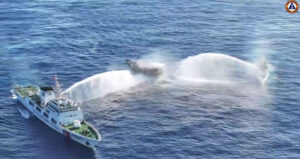 In this frame grab from aerial video footage taken on March 5, 2024 and released by the Philippine Coast Guard (PCG), Chinese Coast Guard ships (L and R) deploy water cannons at the Philippine military-chartered civilian boat Unaizah May 4 (C) during its supply mission near Second Thomas Shoal in the disputed South China Sea. (AFP/File)