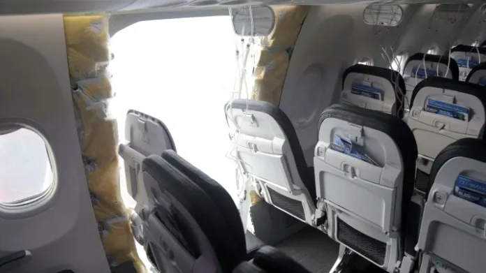 The fuselage plug area of Alaska Airlines Flight 1282 Boeing 737-9 MAX, which was forced to make an emergency landing with a gap in the fuselage, is seen during its investigation by the National Transportation Safety Board (NTSB) in Portland, Oregon, U.S. January 7, 2024. NTSB | Via Reuters