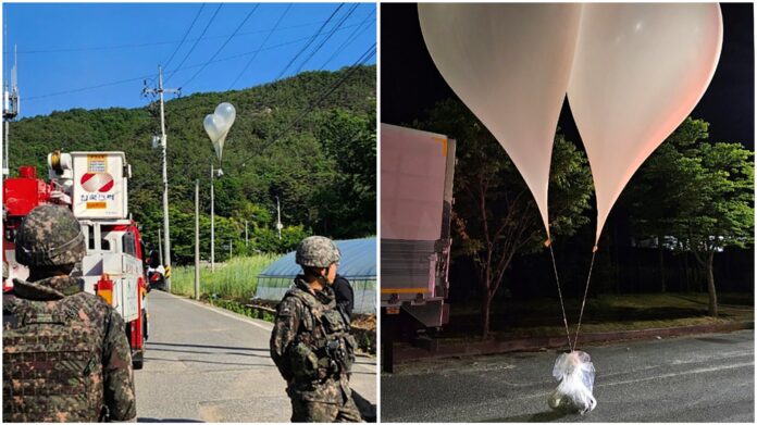 Balloons with trash sent by North Korea hang on electric wires as South Korean army soldiers stand guard in Muju, South Korea, on May 29, 2024. (Jeonbuk Fire Headquarters via AP)