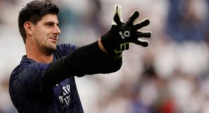 Real Madrid’s Belgian goalkeeper Thibaut Courtois puts his gloves on before the Spanish league football match between Real Madrid CF and Cadiz CF at the Santiago Bernabeu stadium in Madrid on May 4, 2024. (Photo by OSCAR DEL POZO / AFP)