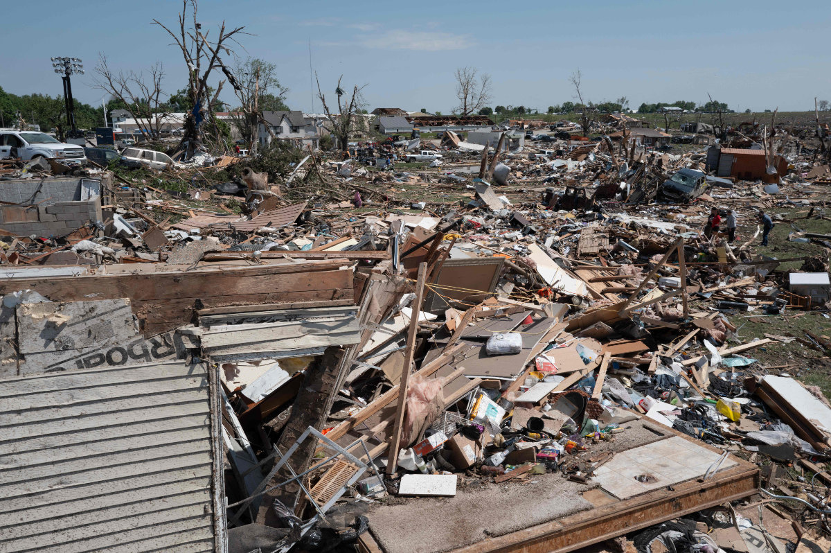Residents go through the damage after a tornado tore through town yesterday afternoon on May 22, 2024 in Greenfield, Iowa. (Getty Images/AFP)