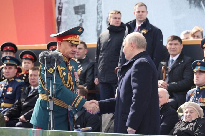 Russian President Vladimir Putin and Defence Minister Sergei Shoigu attend a military parade on Victory Day in Red Square in Moscow, Russia, May 9, 2024.Mikhail Klimentyev/via Reuters