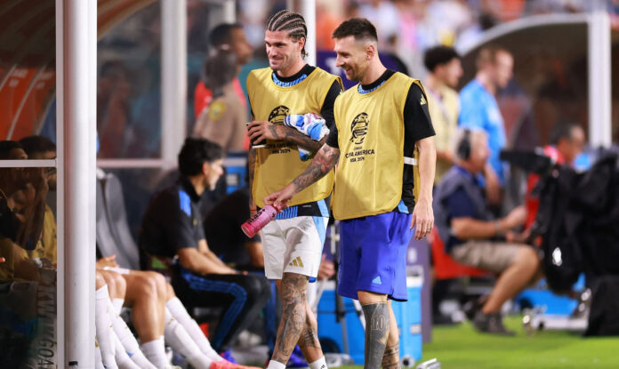 Rodrigo De Paul of Argentina speaks with Lionel Messi of Argentina during the CONMEBOL Copa America 2024 Group A match between Argentina and Peru at Hard Rock Stadium on June 29, 2024 in Miami Gardens, Florida. Photo: AFP