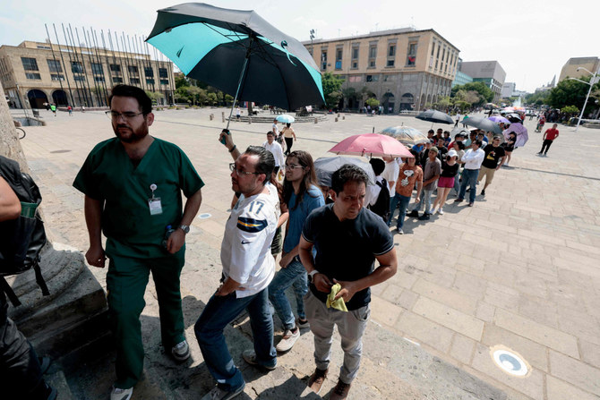 People queue to vote at a polling station in the Cabañas Cultural Center during the general election in Guadalajara, Jalisco state, Mexico, on June 2, 2024. (AFP)