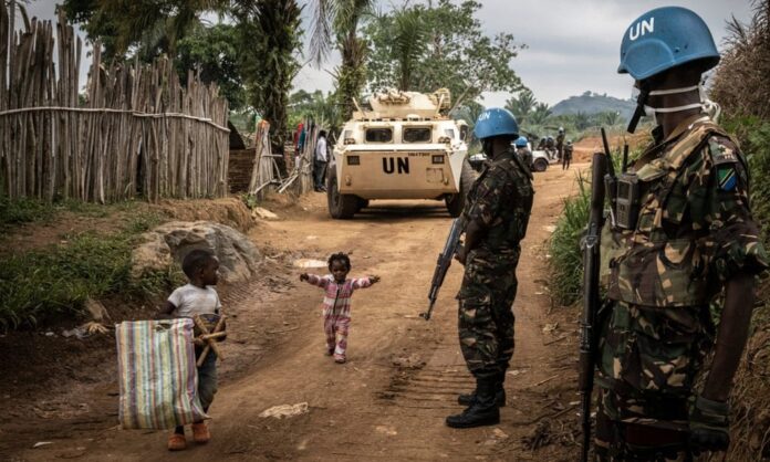 Tanzanian UN peacekeepers in Eringeti to escort road workers back to their base. Uganda has been helping repair roads but locals are suspicious of the neighbouring country’s motives