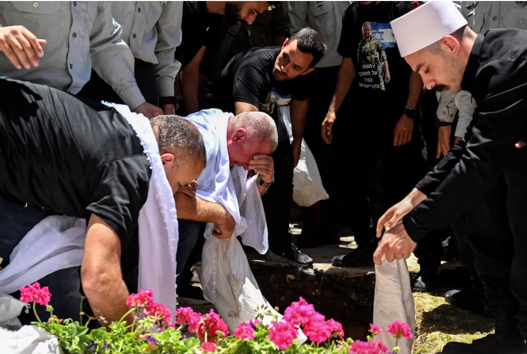 Friends and family mourn Israeli soldier, Captain Wassem Mahmoud from Israel's Druze minority who was killed amid the ongoing conflict in Gaza between Israel and Hamas, at his funeral in Beit Jann, northern Israel, June 16, 2024. REUTERS/Rami Shlush